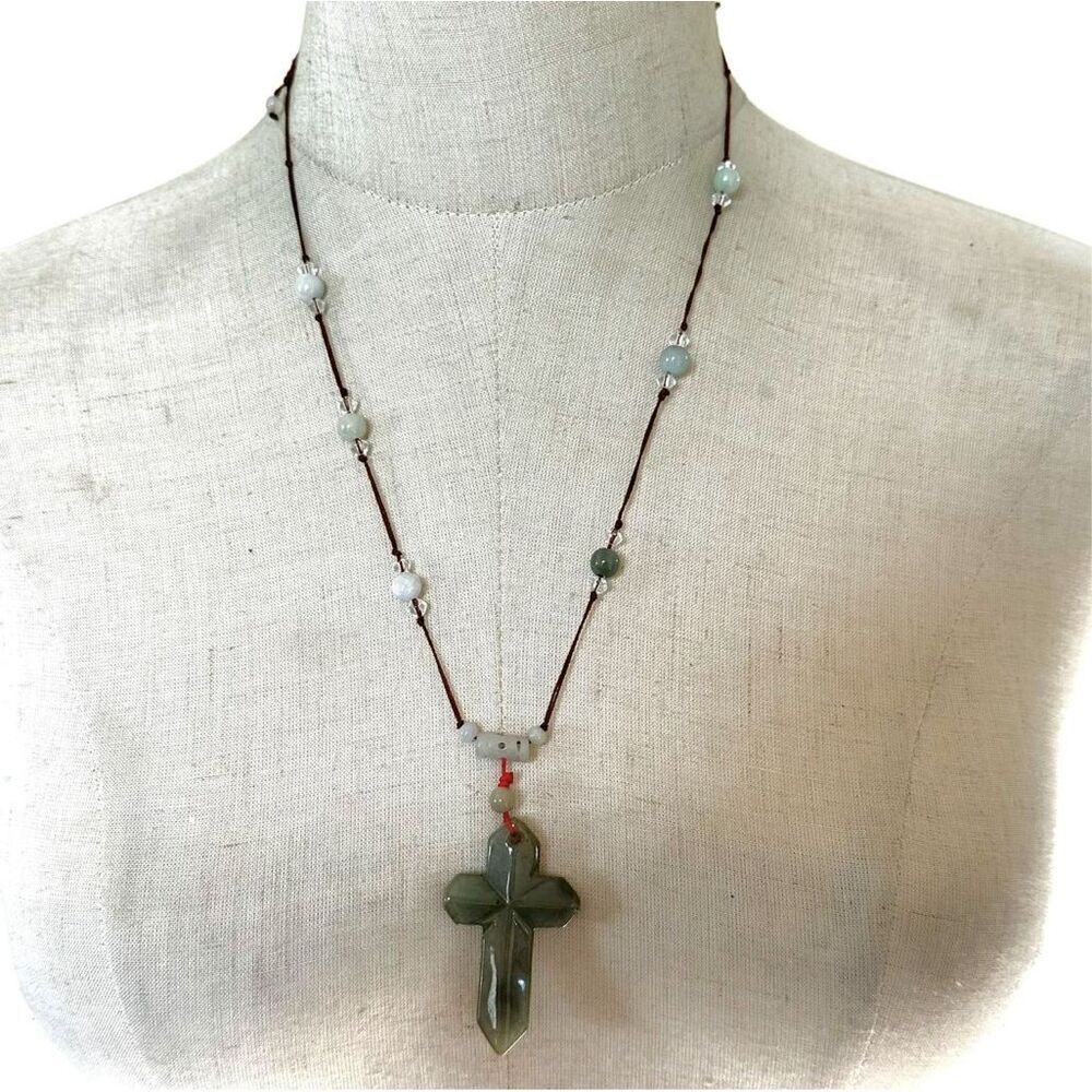 Jade cross pendant necklace on red cord
